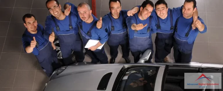ADAG - A group of men raising their thumbs near a silver car