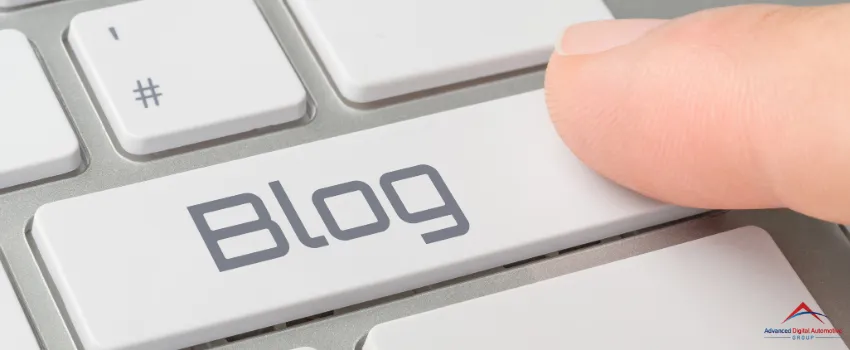 ADAG - Finger pressing on a white blog key button